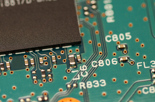 Printed circuit board with semiconductor components, electrical circuits, memory chips, joints and processors.