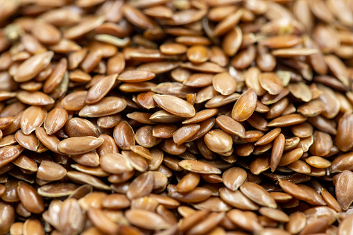 Flax seeds background or texture. Flaxseed or linseed. Cereals. Healthy food. Close up