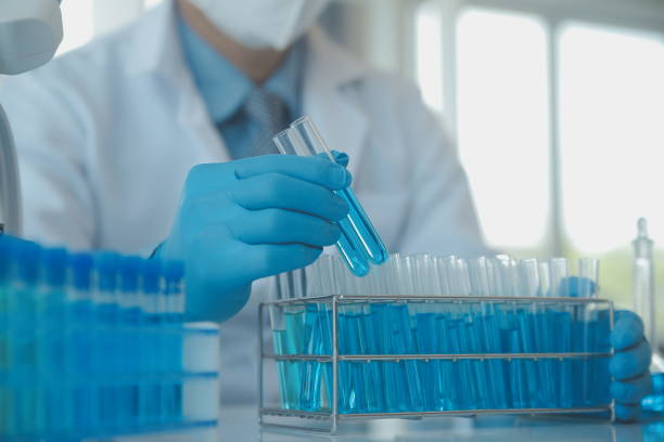 istock biochemical research scientist team working with microscope for coronavirus vaccine development in pharmaceutical research labolatory, selective focus 1493118199