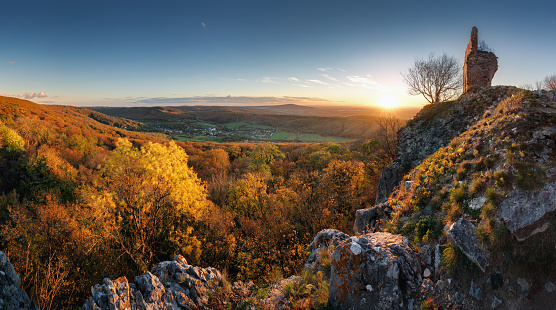 Autumn colorful sunset with village and forest, Slovakia - castle Pajstun