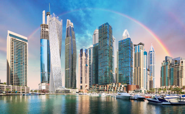 Rainbow over Dubai Marina with skyscrapers, United Arab Emirates Rainbow over Dubai Marina with skyscrapers, United Arab Emirates dubai marina panorama stock pictures, royalty-free photos & images