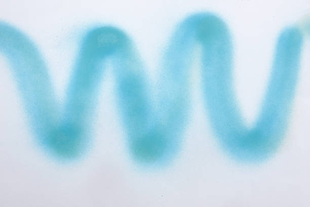 wavy line of blue spray paint on white paper background