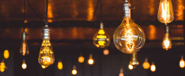 istock Beautiful vintage light bulb. Retro luxury light bulb hanging decor glowing. 1493120330