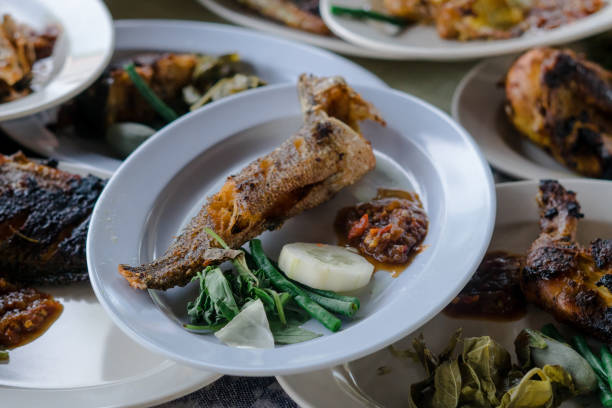 istock Indonesian food serving grilled chicken, grilled fish and fried catfish 1493120838