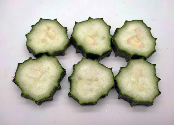 istock Green Luffa acutangula or Ridge gourd isolated on white background 1493122506