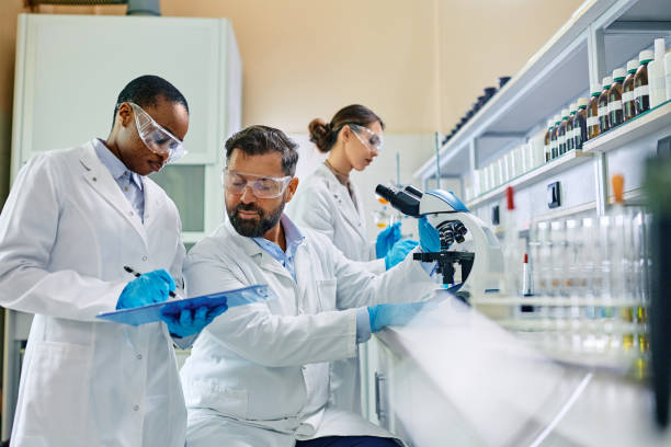 istock Pharmaceutical scientist cooperating while working on new research in laboratory. 1493125151