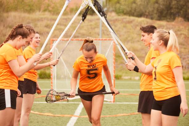 istock Celebratory Tunnel: Lacrosse Team Welcomes and Congratulates Running Teammate 1493125232