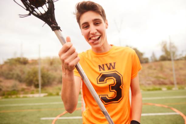 istock Confident Lacrosse Player Expressing Playfulness in a Field 1493125234