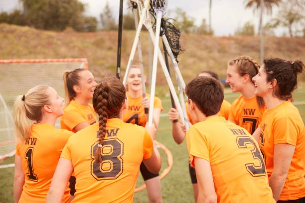 istock Triumphant Lacrosse Team Raises Sticks in Victory Celebration 1493125249