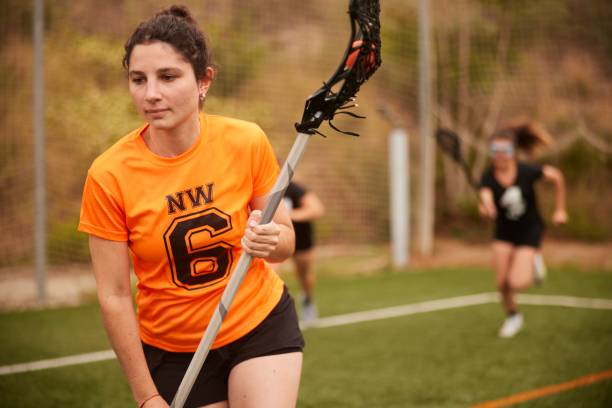 istock Action-Packed Moment as Lacrosse Athlete Sprints Along Sideline, Skillfully Cradling Stick. 1493125286