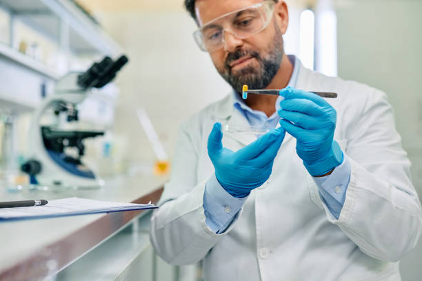 istock Close up of scientist developing new medicine during research in pharmaceutical lab. 1493125295