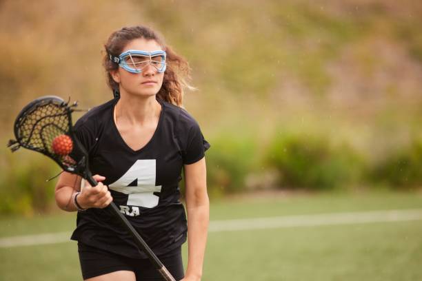 istock Unleashing the Speed: Lacrosse Player's Face Reflects the Exertion Fast Run. 1493125310