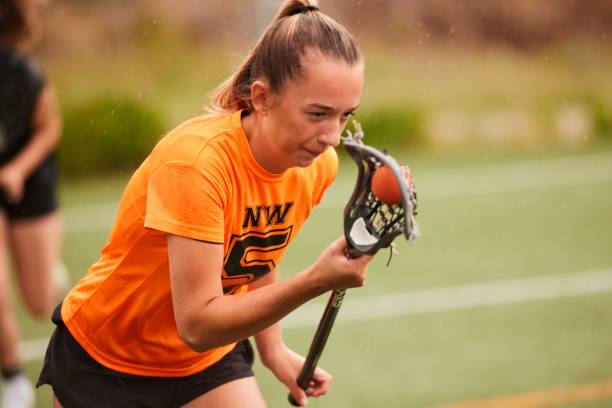 istock Lacrosse Player's Face Reveals Struggle and Perseverance in Rapid Run. 1493125328