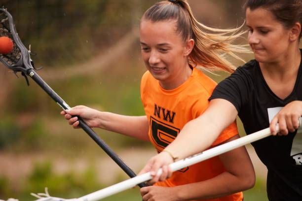 istock Intense Moment as Lacrosse Defender Steps Up, Impeding Rival's Progress 1493125340