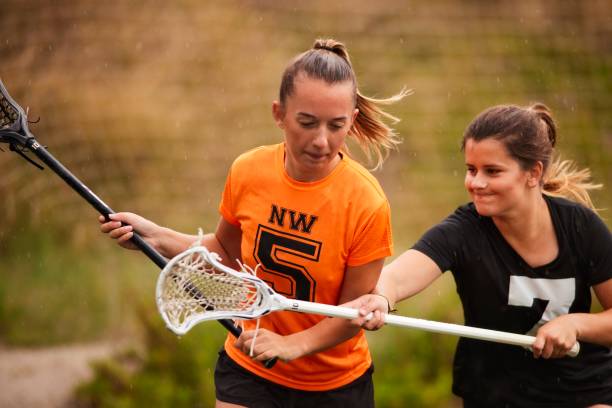istock Defensive Play in Lacrosse: Dedicated Player Blocks Opponent's Escape Route 1493125347