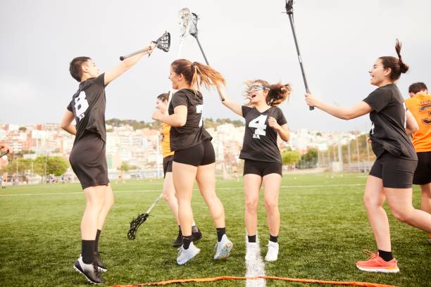 istock Triumphant Celebration: Lacrosse Players Soar with Joy After Scoring. 1493125842