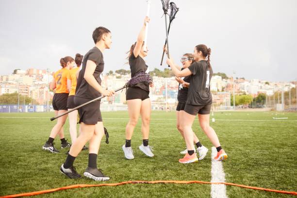 istock Ecstatic Victory: Lacrosse Players Unleash Their Joy in Mid-Air Celebration 1493125874