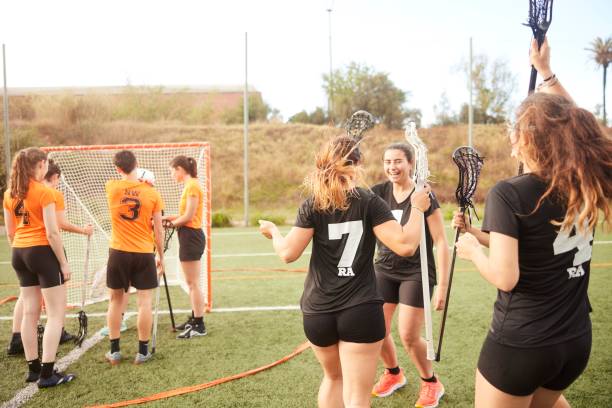 istock Elation in Unity: Lacrosse Team Huddles in Joy as Opponents Display Defeat 1493125941