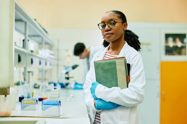 istock Black female scientist working in lab and looking at camera. 1493125996