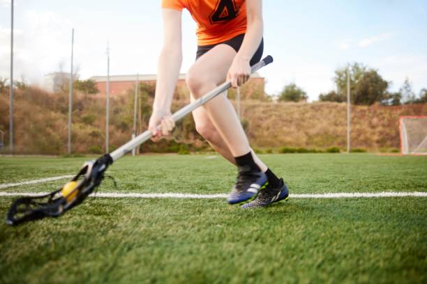 istock Unrecognizable Player Aims to Scoop Ground Ball in Wide-Angle Close-Up