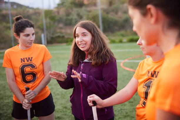 istock Leadership in Action: Female Lacrosse Coach Engages Team Members with Instructions 1493126044