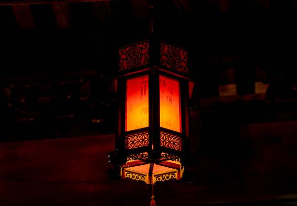 This is an antique lantern, suspended from the ceiling of a charming restaurant