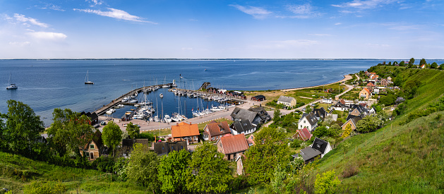 Panoramic view over Kyrkbacken and harbor on the Swedish island Ven in the Oresund strait. Denmark can be seen in the background.