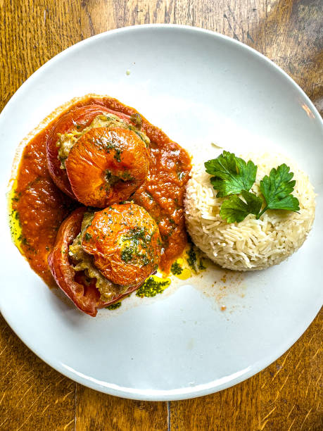 istock stuffed tomatoes with rice on a white plate 1493132725