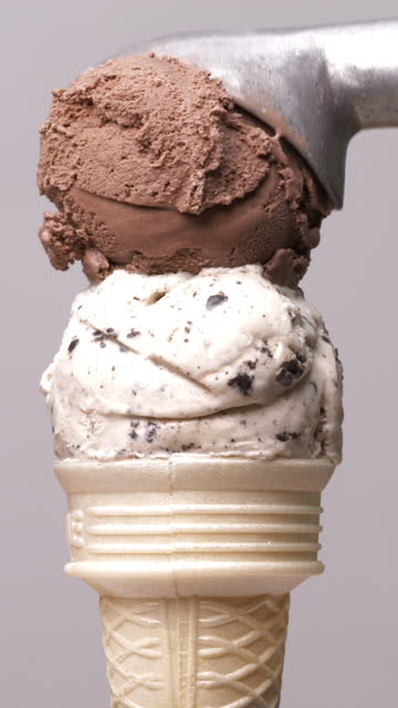 Scoop ice cream cones Chocolate stacked on ice cream cookies gray background.