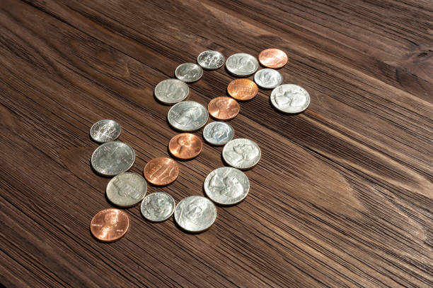 istock American Coins Arranged into a Dollar Sign Symbol 1493143068