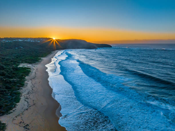 istock Sunrise and waves at the seaside 1493144144