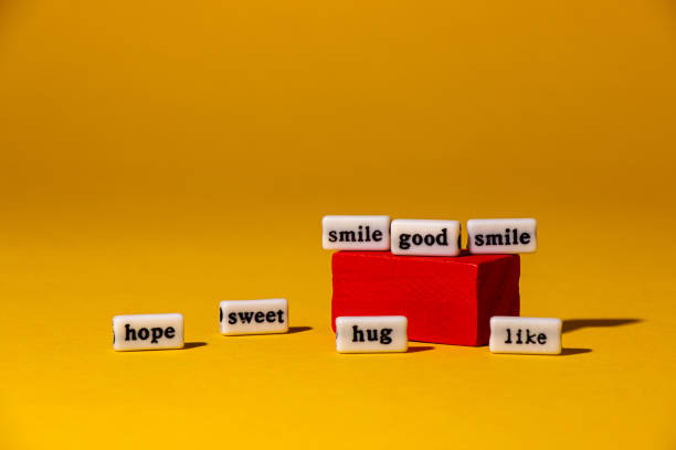 istock positive words on the square and next to it, yellow background, creative concept 1493147888