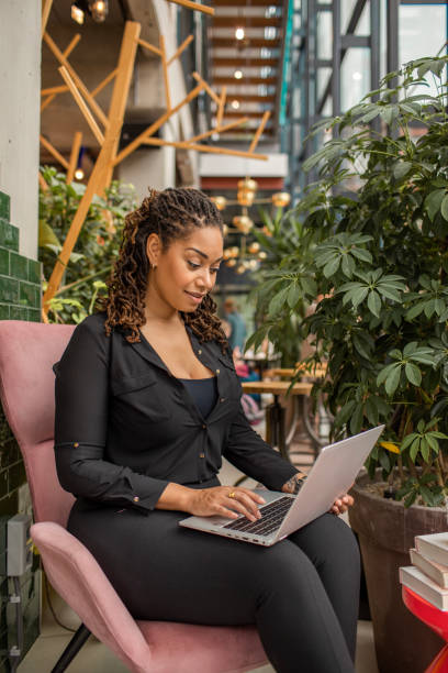 istock Beautiful diverse woman using an AI chatbot 1493148474