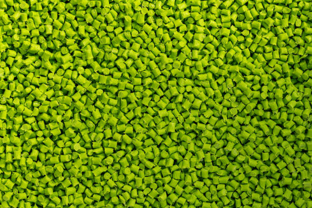 close-up of light green plastic resin (masterbatch) spread on a tray - polyethylene terephthalate imagens e fotografias de stock