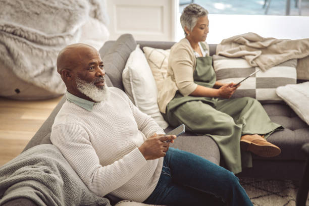 istock Mature couple relaxing in the sofa 1493150592