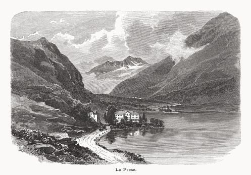 Historical view of Le Prese - a village in the Val Poschiavo in the canton of Graubünden, Switzerland. It lies at 965 metres (3,166 ft) above sea level at the northern end of Lago di Poschiavo, and is in the municipality of Poschiavo, some 4 kilometres (2.5 mi) south of the village of the same name. In the middle of the 19th century, Le Prese was developed as a spa town, with the 1856 construction of the spa building and further improvements in 1861. The sulphur spa was well frequented until 1914. The spa (Albergo Bagni Le Prese/Kurhaus Le Prese) is on the Swiss Inventory of Cultural Property of National and Regional Significance. Wood engraving after a drawing by Edward Theodore Compton (English painter, 1849 - 1921), published in 1877.