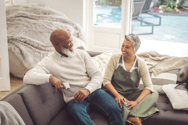 istock Mature couple relaxing in the sofa 1493151381