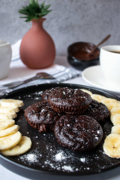 istock Delicious chocolate banana muffins. Dessert. On a white background 1493151432