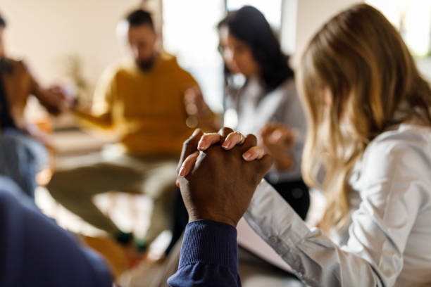 istock People in group therapy holding hands as a sign of support for one another 1493153112