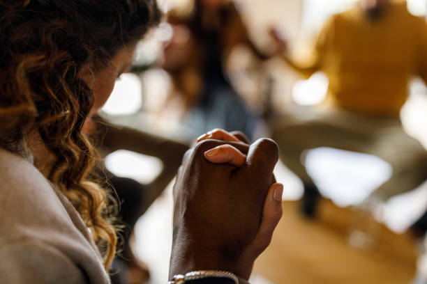istock People in group therapy holding hands as a sign of support for one another 1493153239