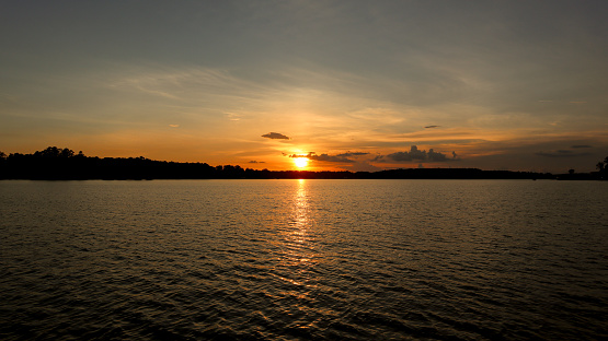 Some little cloud blips highlight this sunset taken on beautiful Lake Sinclair in Milledgeville, Georgia.