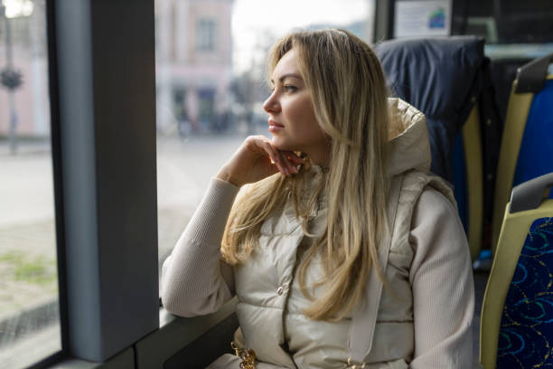 istock Pretty girl looking out the bus window 1493155976