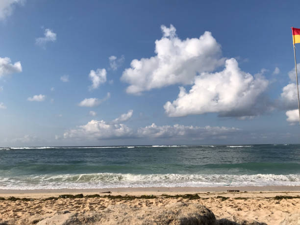 istock beach view with cloudy sky and horizon dan blue sea 1493160365