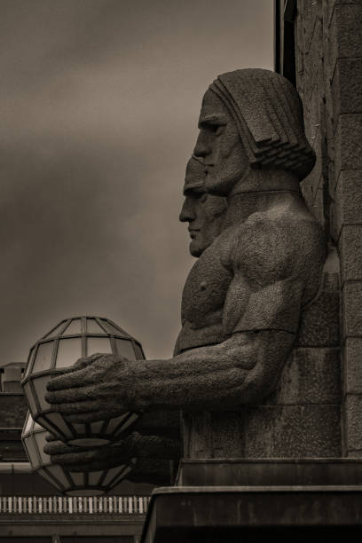 Statues from outside of Helsinki's train station. They are called Lyhdynkantajat or known in English as \