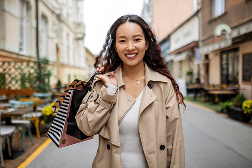 Smiling beautiful woman with shopping bags