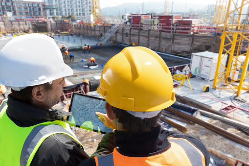 top view of construction site with multinational worker