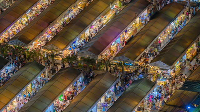 Timelapse Crowded of tourist Shopping Rod Fai bazaar night Market Bangkok Thailand