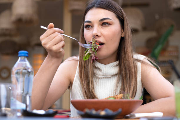 istock woman eating vegetarian food 1493179920