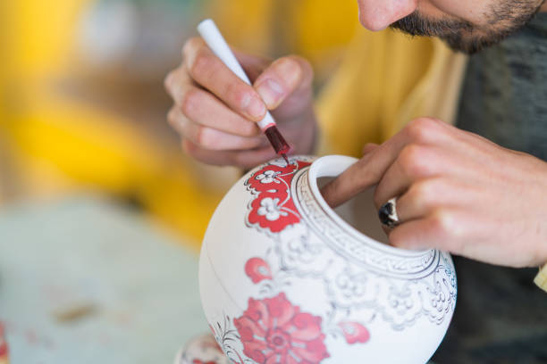 istock Artisan with tile painting art 1493182522