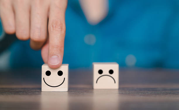istock Customer pointing finger on wooden block smiley face icon. Customer satisfaction evaluation concept, good experience, good review, high score, impressive service. 1493184839